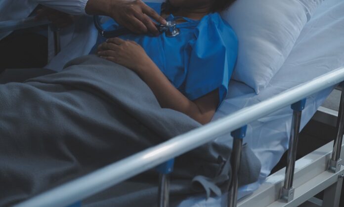 Doctor and patient discussing something while sitting at the tab