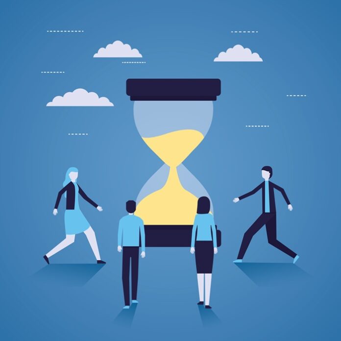 businessman and woman hourglass time