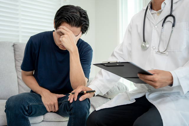 Man hold hand in front of private parts feeling discomfort and c